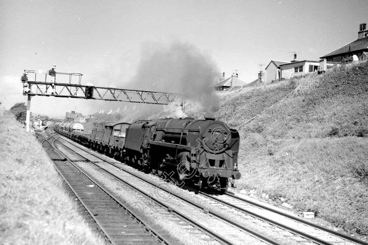 WD2657 
 ENGINE CLASS: BR Class 9 ENGINE NUMBER: 92121 LOCATION: Hest Bank DATE: 29 June 1966 COMMENTS: 
 Keywords: 29 June 1966, 92121, BR Class 9, Cooperline, Hest bank, Steam, WD Cooper, locomotives, railway photography, trains