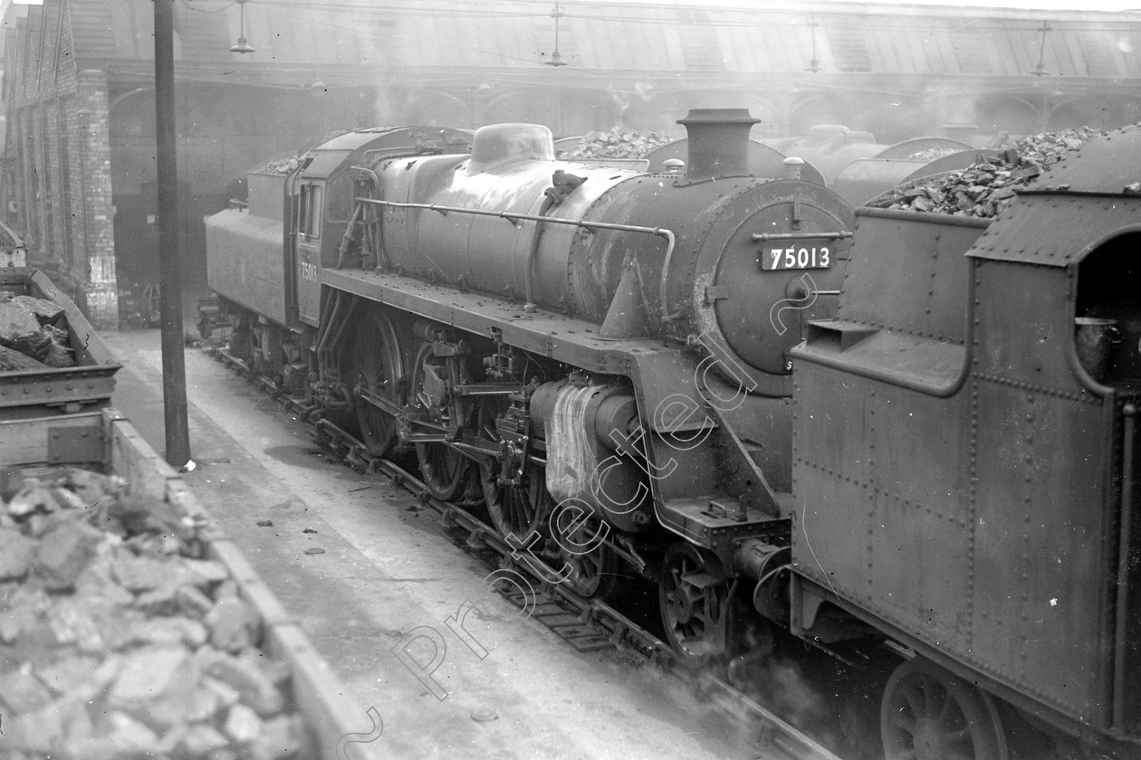 WD2465 
 ENGINE CLASS: BR 75000 4-6-0 ENGINE NUMBER: 75013 LOCATION: Patricroft DATE: 00.04.1952 COMMENTS: 
 Keywords: 00.04.1952, 75013, BR 75000 4-6-0, Cooperline, Patricroft, Steam, WD Cooper, locomotives, railway photography, trains