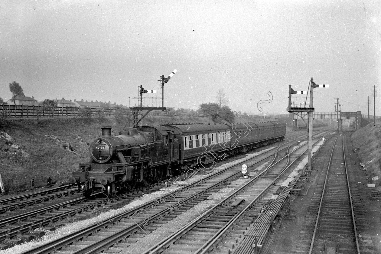 WD0584 
 ENGINE CLASS: 2-6-2 Tanks Stanier and Ivatt ENGINE NUMBER: 40199 LOCATION: Dobs Brow DATE: 00.04.1952 COMMENTS: 
 Keywords: 00.04.1952, 2-6-2 Tanks Stanier and Ivatt, 40199, Cooperline, Dobs Brow, Steam, WD Cooper, locomotives, railway photography, trains