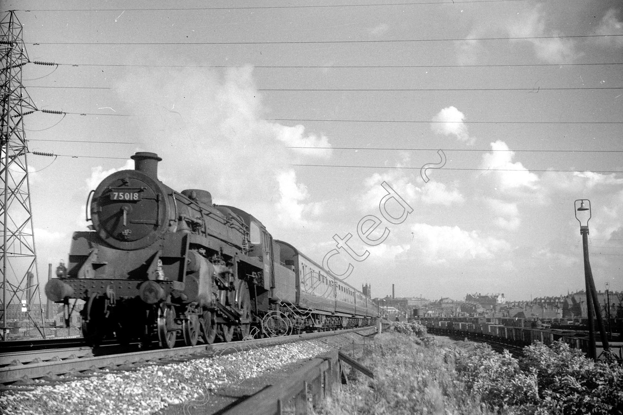 WD2473 
 ENGINE CLASS: BR 75000 4-6-0 ENGINE NUMBER: 75018 LOCATION: Pendlebury Bank DATE: 12 August 1960 COMMENTS: 
 Keywords: 12 August 1960, 75018, BR 75000 4-6-0, Cooperline, Pendlebury Bank, Steam, WD Cooper, locomotives, railway photography, trains