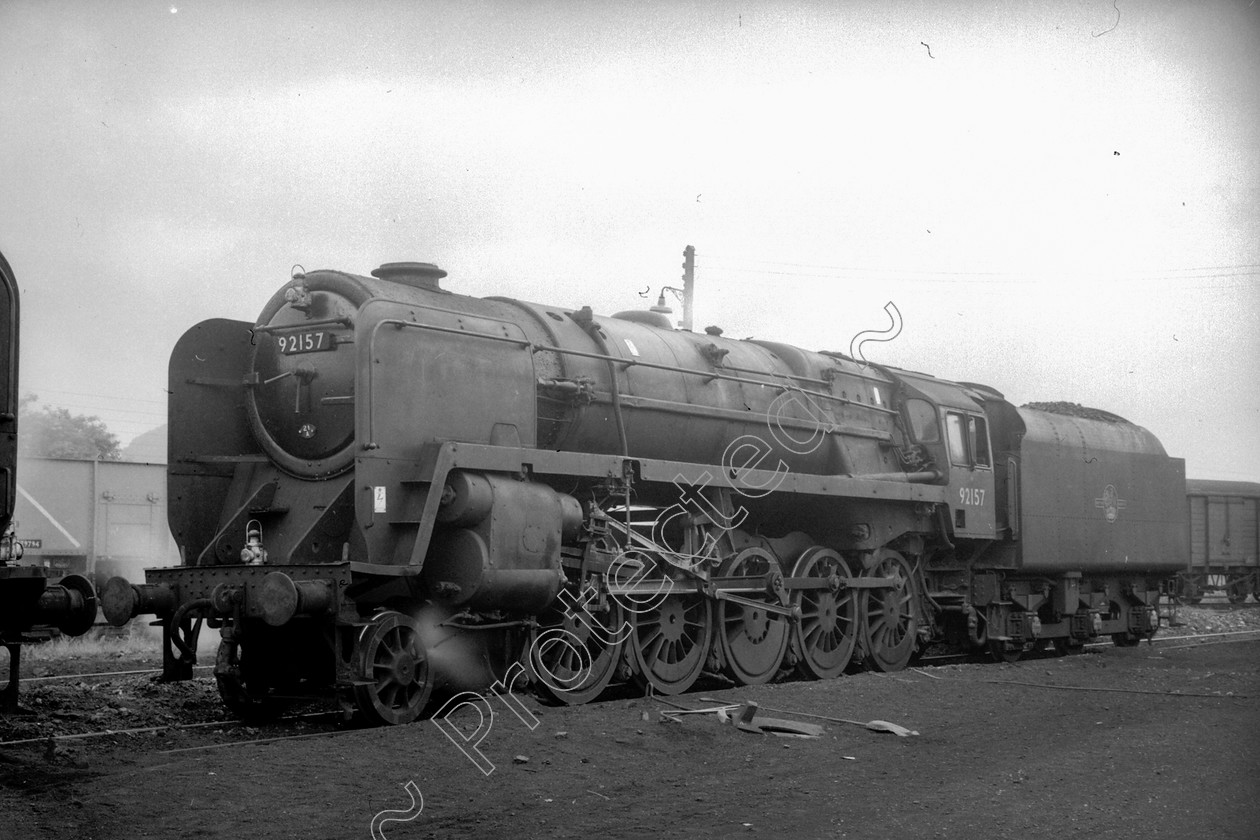 WD2667 
 ENGINE CLASS: BR Class 9 ENGINE NUMBER: 92157 LOCATION: Rowsley DATE: 12 June 1961 COMMENTS: 
 Keywords: 12 June 1961, 92157, BR Class 9, Cooperline, Rowsley, Steam, WD Cooper, locomotives, railway photography, trains