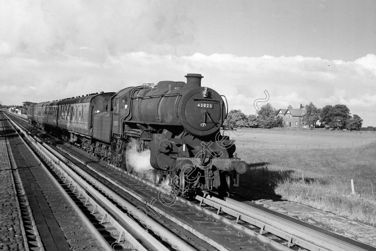 WD0887 
 ENGINE CLASS: Ivatt 6400 & 3000 ENGINE NUMBER: 43025 LOCATION: Hest Bank DATE: 26 June 1962 COMMENTS: 
 Keywords: 26 June 1962, 43025, Cooperline, Hest bank, Ivatt 6400 & 3000, Steam, WD Cooper, locomotives, railway photography, trains