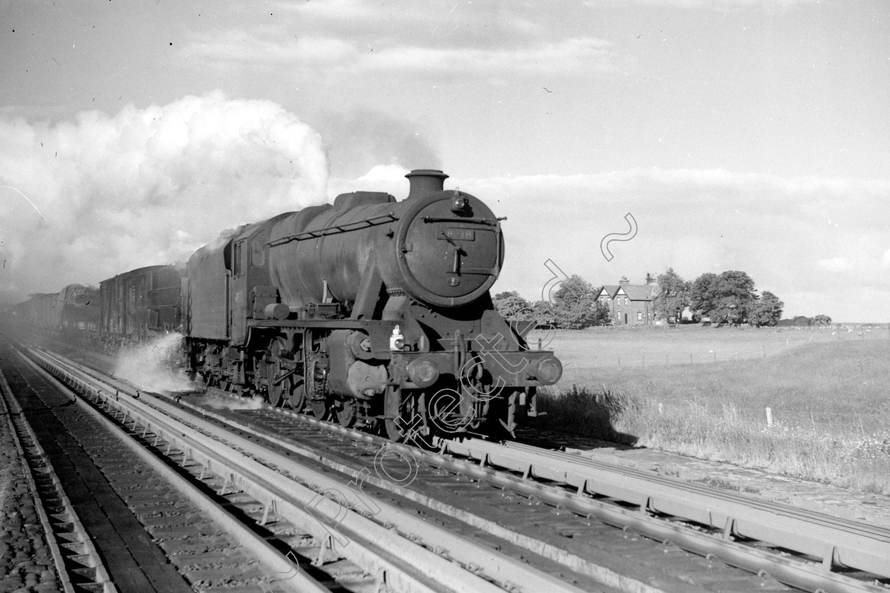 WD2030 
 ENGINE CLASS: Stanier Class 8 2-8-0 ENGINE NUMBER: 48318 LOCATION: Hest Bank DATE: 26 June 1962 COMMENTS: 
 Keywords: 26 June 1962, 48318, Cooperline, Hest bank, Stanier Class 8 2-8-0, Steam, WD Cooper, locomotives, railway photography, trains