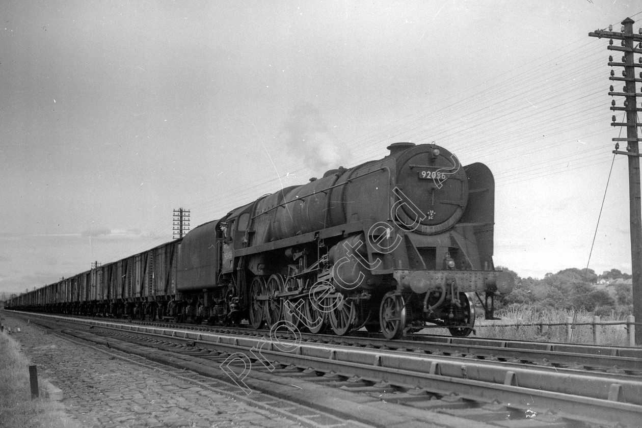 WD2637 
 ENGINE CLASS: BR Class 9 ENGINE NUMBER: 92056 LOCATION: Hest Bank DATE: 21 June 1961 COMMENTS: 
 Keywords: 21 June 1961, 92056, BR Class 9, Cooperline, Hest bank, Steam, WD Cooper, locomotives, railway photography, trains