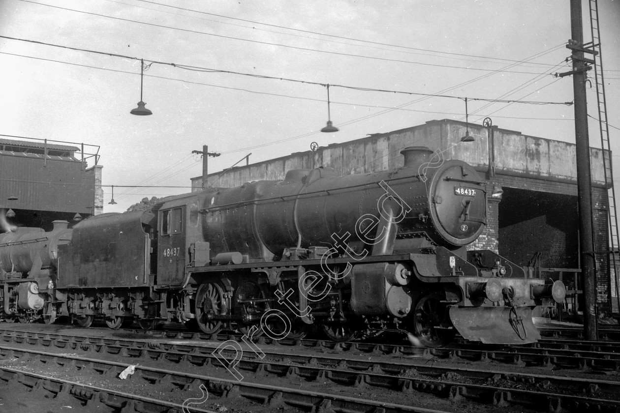 WD2045 
 ENGINE CLASS: Stanier Class 8 2-8-0 ENGINE NUMBER: 48437 LOCATION: Patricroft DATE: 01 February 1964 COMMENTS: 
 Keywords: 01 February 1964, 48437, Cooperline, Patricroft, Stanier Class 8 2-8-0, Steam, WD Cooper, locomotives, railway photography, trains