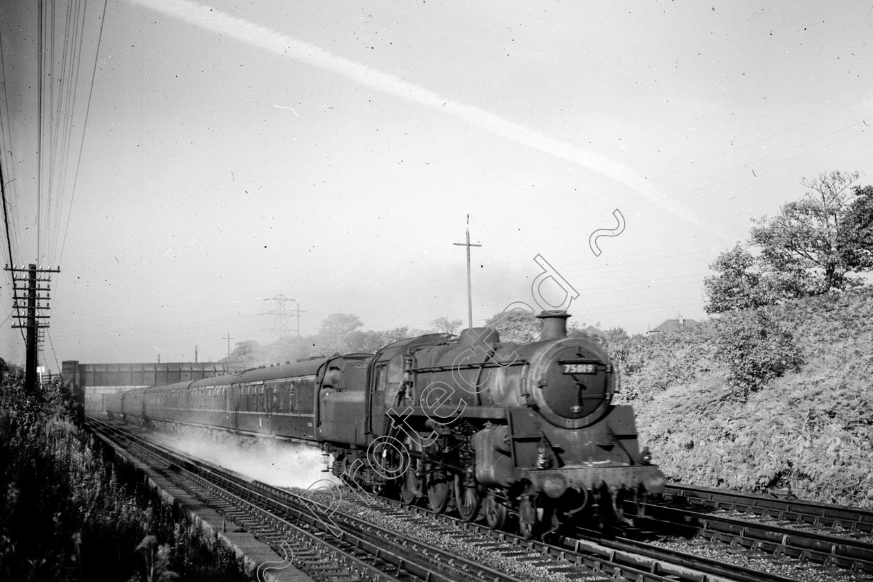 WD2478 
 ENGINE CLASS: BR 75000 4-6-0 ENGINE NUMBER: 75019 LOCATION: Walkden Troughs DATE: 26 September 1960 COMMENTS: 
 Keywords: 26 September 1960, 75019, BR 75000 4-6-0, Cooperline, Steam, WD Cooper, Walkden Troughs, locomotives, railway photography, trains