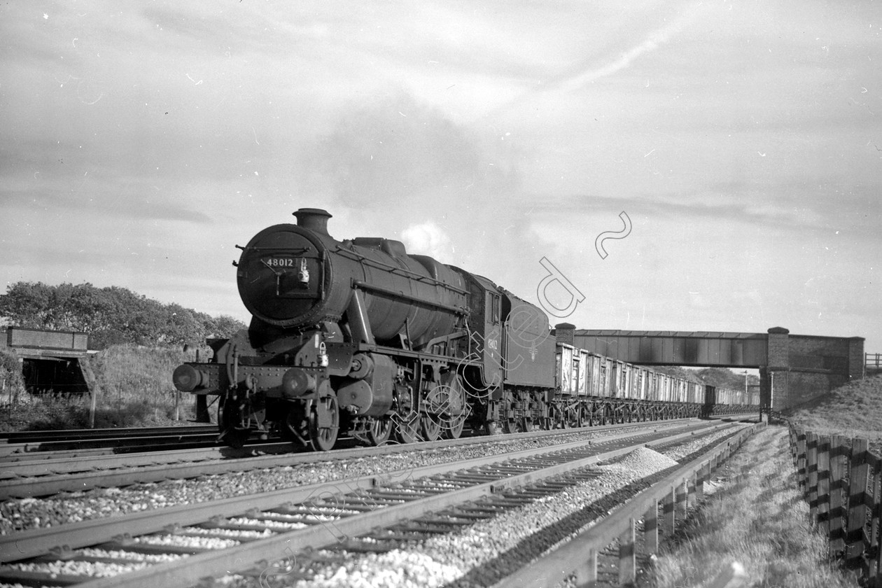 WD2002 
 ENGINE CLASS: Stanier Class 8 2-8-0 ENGINE NUMBER: 48012 LOCATION: Winwick DATE: 16 September 1965 COMMENTS: 
 Keywords: 16 September 1965, 48012, Cooperline, Stanier Class 8 2-8-0, Steam, WD Cooper, Winwick, locomotives, railway photography, trains