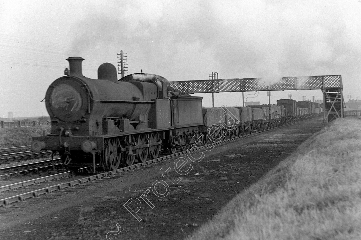 WD0906 
 ENGINE CLASS: L.N.W.R. ENGINE NUMBER: 8918 LOCATION: Golborne DATE: 18 October 1945 COMMENTS: 
 Keywords: 18 October 1945, 8918, Cooperline, Golborne, L.N.W.R., Steam, WD Cooper, locomotives, railway photography, trains