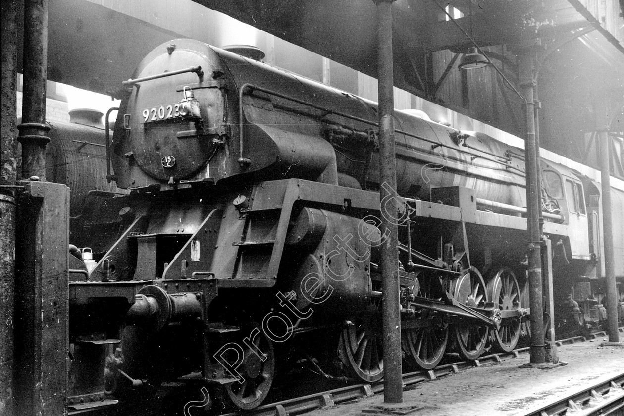 WD2620 
 ENGINE CLASS: BR Class 9 ENGINE NUMBER: 92023 LOCATION: Patricroft DATE: 08 February 1964 COMMENTS: 
 Keywords: 08 February 1964, 92023, BR Class 9, Cooperline, Patricroft, Steam, WD Cooper, locomotives, railway photography, trains