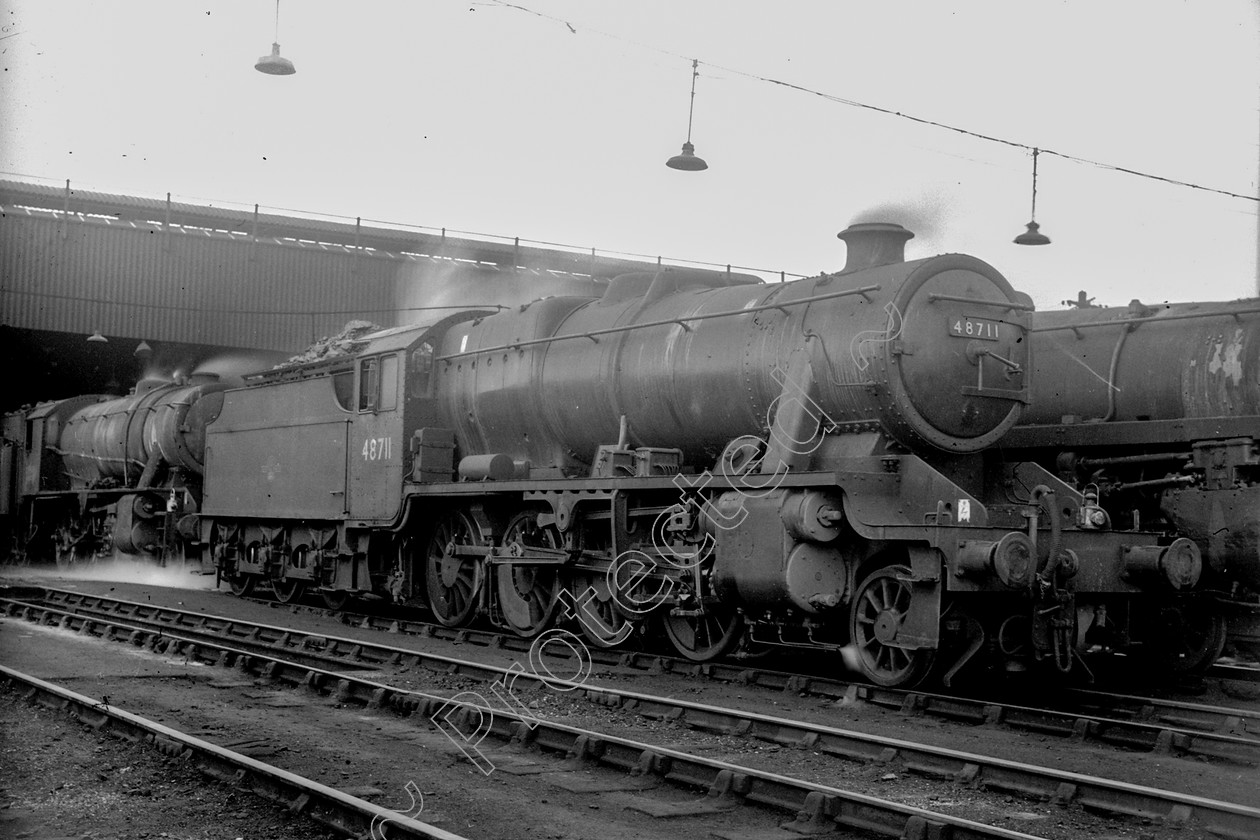 WD2073 
 ENGINE CLASS: Stanier Class 8 2-8-0 ENGINE NUMBER: 48711 LOCATION: Patricroft DATE: 12 April 1965 COMMENTS: 
 Keywords: 12 April 1965, 48711, Cooperline, Patricroft, Stanier Class 8 2-8-0, Steam, WD Cooper, locomotives, railway photography, trains