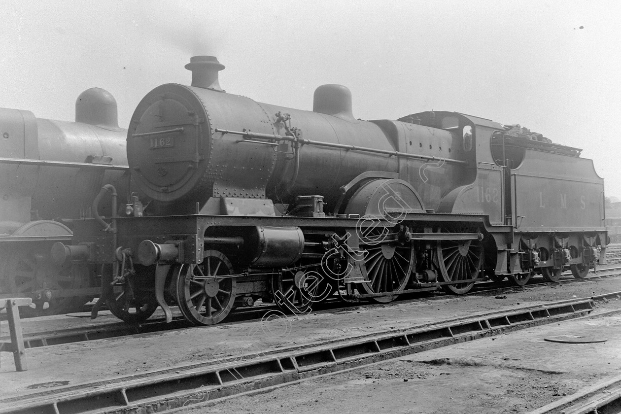 WD0503 
 ENGINE CLASS: Midland Compounds ENGINE NUMBER: 1162 LOCATION: Carnforth DATE: 21 May 1938 COMMENTS: 
 Keywords: 1162, 21 May 1938, Carnforth, Cooperline, Midland Compounds, Steam, WD Cooper, locomotives, railway photography, trains