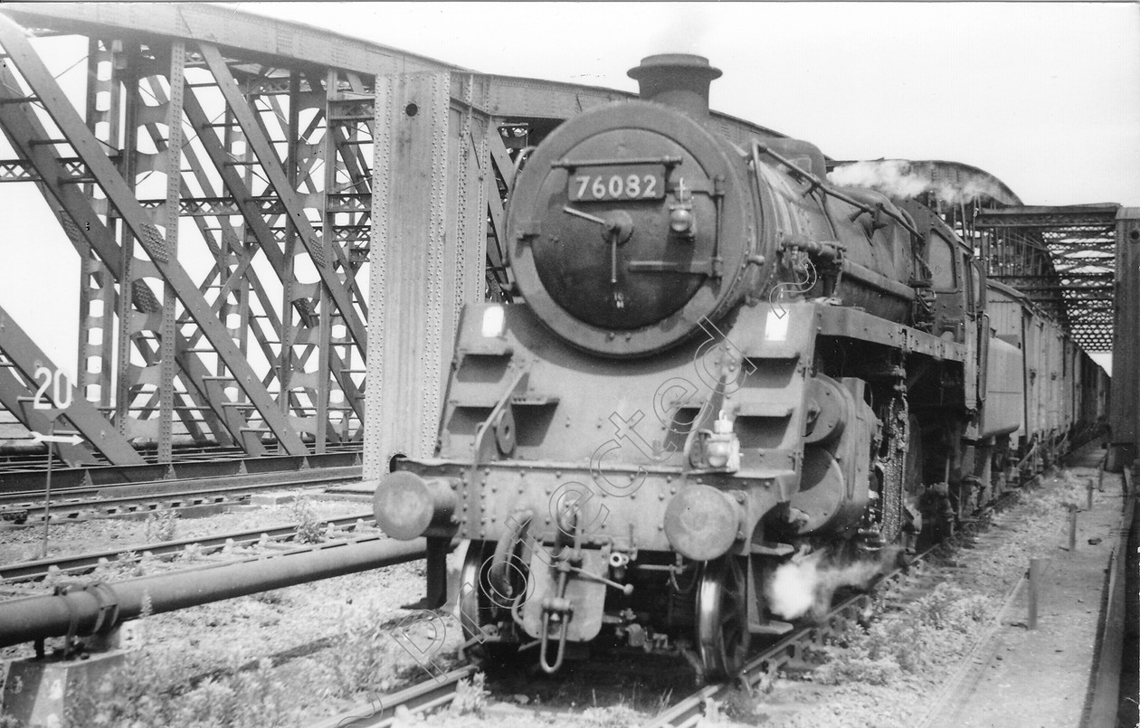 WD0696 
 ENGINE CLASS: Moguls 2-6-0 ENGINE NUMBER: 76082 LOCATION: Canal Bridge DATE: 28 June 1965 COMMENTS: 
 Keywords: 28 June 1965, 76082, Canal Bridge, Cooperline, Moguls 2-6-0, Steam, WD Cooper, locomotives, railway photography, trains