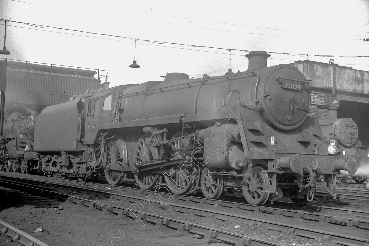 WD2424 
 ENGINE CLASS: BR 73000 4-6-0 ENGINE NUMBER: 73094 LOCATION: Patricroft DATE: 16 February 1965 COMMENTS: 
 Keywords: 16 February 1965, 73094, BR 73000 4-6-0, Cooperline, Patricroft, Steam, WD Cooper, locomotives, railway photography, trains