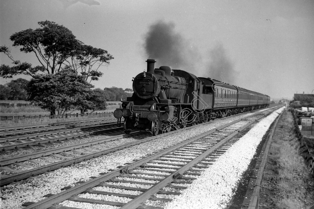 WD0880 
 ENGINE CLASS: Ivatt 6400 & 3000 ENGINE NUMBER: 46486 LOCATION: Winwick DATE: 13 July 1964 COMMENTS: 
 Keywords: 13 July 1964, 46486, Cooperline, Ivatt 6400 & 3000, Steam, WD Cooper, Winwick, locomotives, railway photography, trains