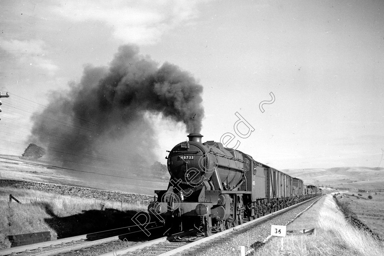 WD2077 
 ENGINE CLASS: Stanier Class 8 2-8-0 ENGINE NUMBER: 48733 LOCATION: Shap bank DATE: 27 August 1959 COMMENTS: 
 Keywords: 27 August 1959, 48733, Cooperline, Shap bank, Stanier Class 8 2-8-0, Steam, WD Cooper, locomotives, railway photography, trains