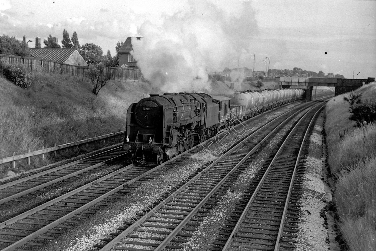 WD2604 
 ENGINE CLASS: BR Class 9 ENGINE NUMBER: 92008 LOCATION: Golborne DATE: 05 August 1966 COMMENTS: 
 Keywords: 05 August 1966, 92008, BR Class 9, Cooperline, Golborne, Steam, WD Cooper, locomotives, railway photography, trains