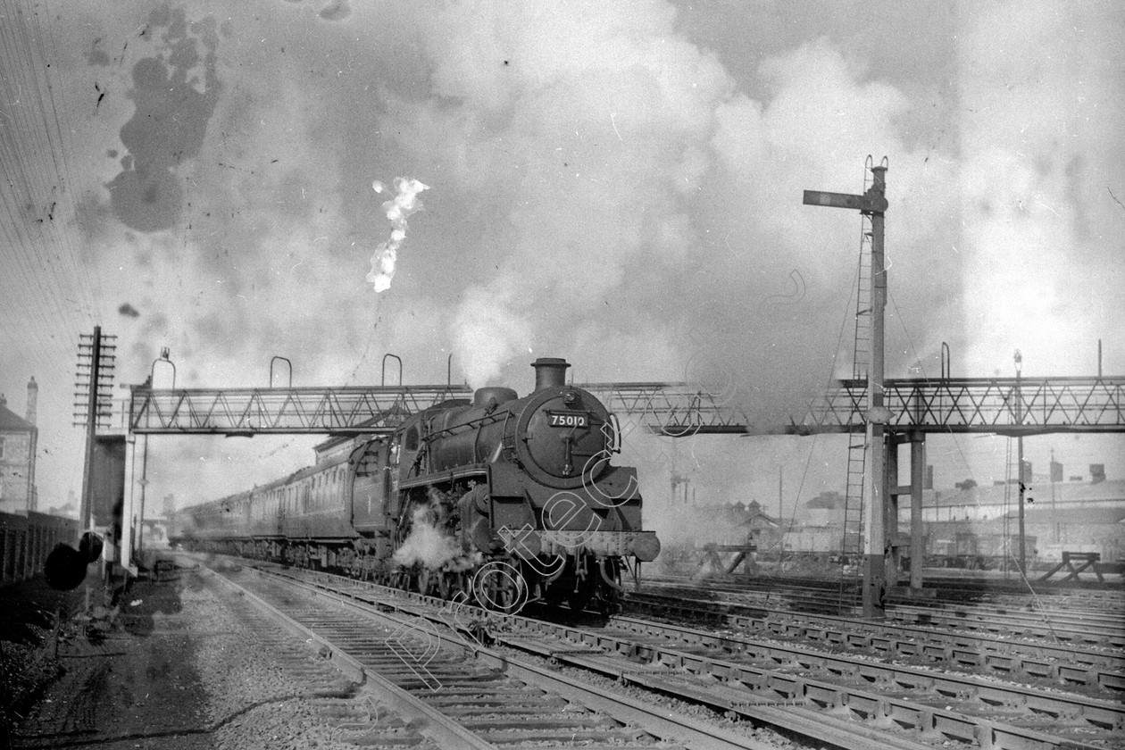 WD2461 
 ENGINE CLASS: BR 75000 4-6-0 ENGINE NUMBER: 75010 LOCATION: Patricroft DATE: 03 March 1959 COMMENTS: 
 Keywords: 03 March 1959, 75010, BR 75000 4-6-0, Cooperline, Patricroft, Steam, WD Cooper, locomotives, railway photography, trains