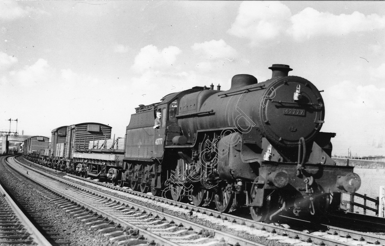 WD0632 
 ENGINE CLASS: Moguls 2-6-0 ENGINE NUMBER: 42777 LOCATION: Winwick DATE: 15 March 1963 COMMENTS: 
 Keywords: 15 March 1963, 42777, Cooperline, Moguls 2-6-0, Steam, WD Cooper, Winwick, locomotives, railway photography, trains