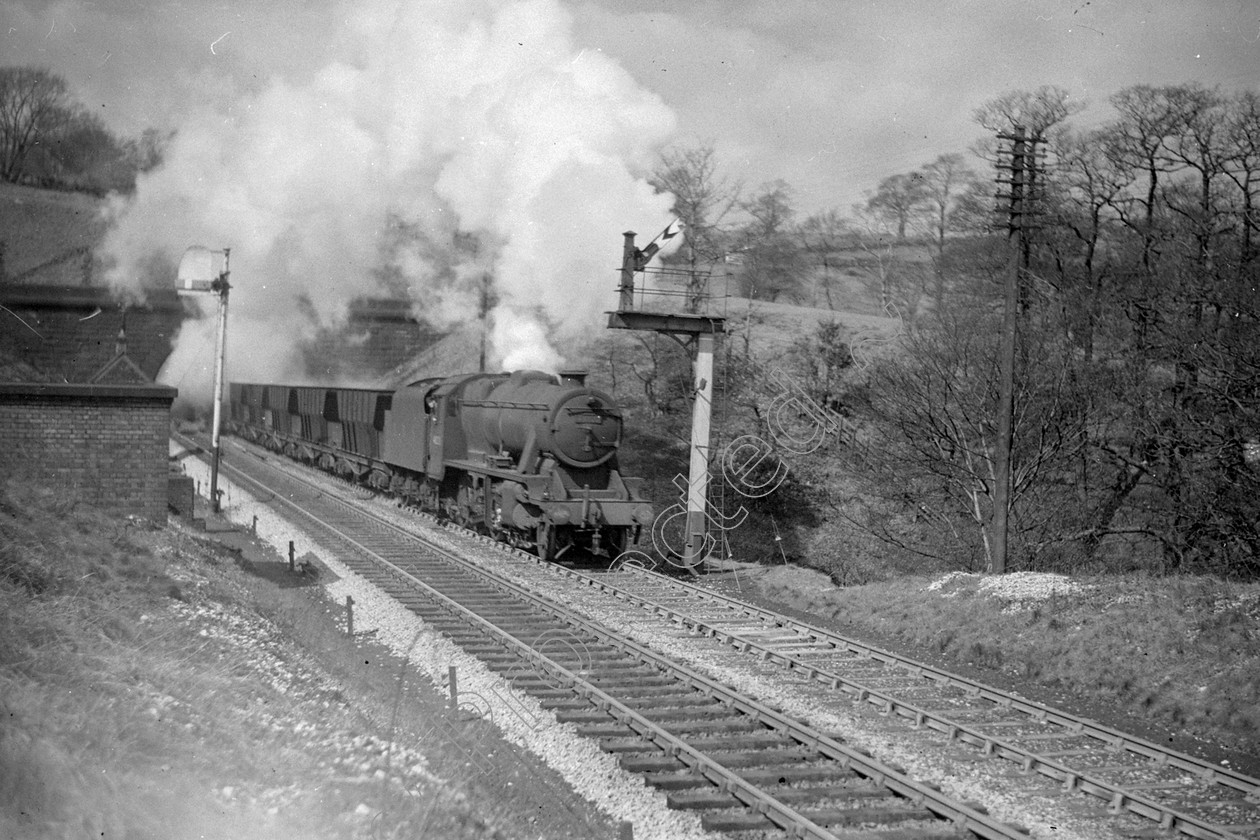 WD2021 
 ENGINE CLASS: Stanier Class 8 2-8-0 ENGINE NUMBER: 48220 LOCATION: Disley DATE: 09 April 1949 COMMENTS: 
 Keywords: 09 April 1949, 48220, Cooperline, Disley, Stanier Class 8 2-8-0, Steam, WD Cooper, locomotives, railway photography, trains