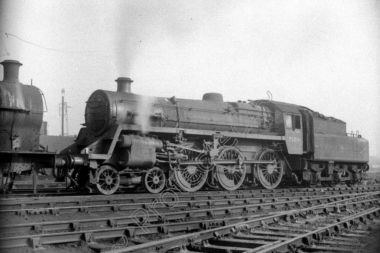 WD2462 
 ENGINE CLASS: BR 75000 4-6-0 ENGINE NUMBER: 75011 LOCATION: Patricroft DATE: 21 October 1960 COMMENTS: 
 Keywords: 21 October 1960, 75011, BR 75000 4-6-0, Cooperline, Patricroft, Steam, WD Cooper, locomotives, railway photography, trains