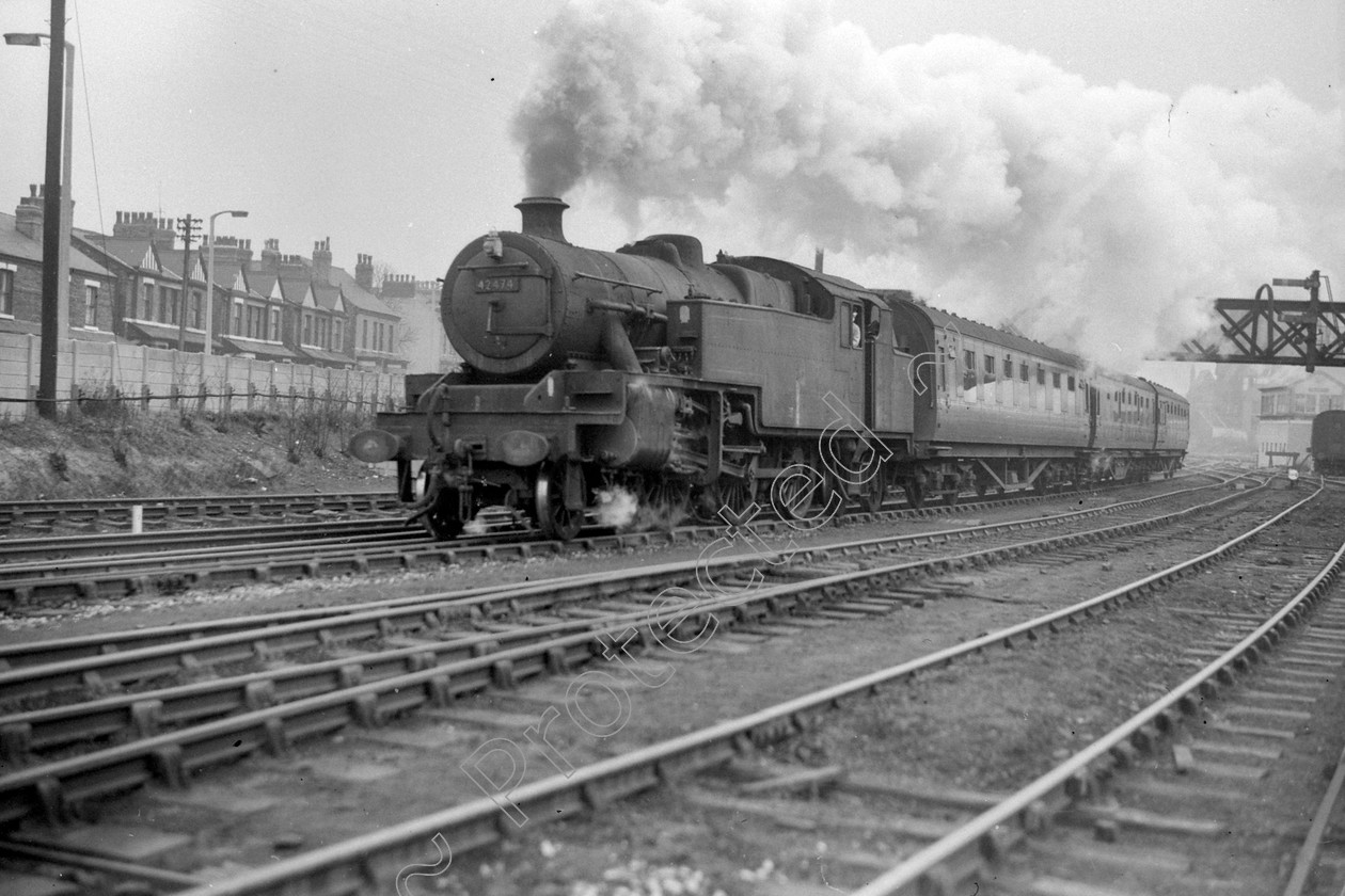 WD1054 
 ENGINE CLASS: 2-6-4 Tanks ENGINE NUMBER: 42474 LOCATION: Patricroft DATE: 30 March 1964 COMMENTS: One of the last Manchester Wigan trains 
 Keywords: 2-6-4 Tanks, 30 March 1964, 42474, Cooperline, One of the last Manchester Wigan trains, Patricroft, Steam, WD Cooper, locomotives, railway photography, trains