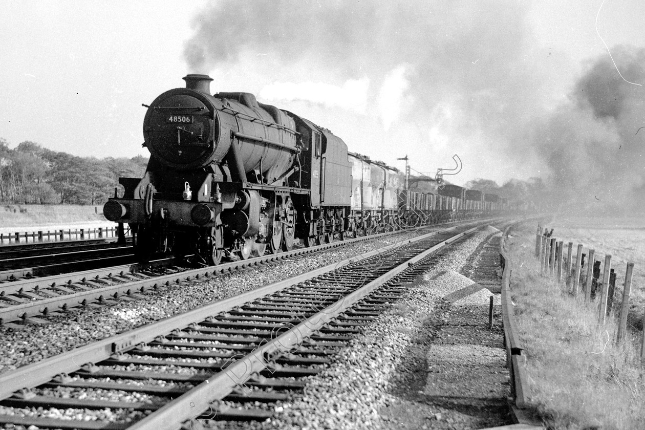 WD2053 
 ENGINE CLASS: Stanier Class 8 2-8-0 ENGINE NUMBER: 48506 LOCATION: Winwick DATE: 08 October 1965 COMMENTS: 
 Keywords: 08 October 1965, 48506, Cooperline, Stanier Class 8 2-8-0, Steam, WD Cooper, Winwick, locomotives, railway photography, trains