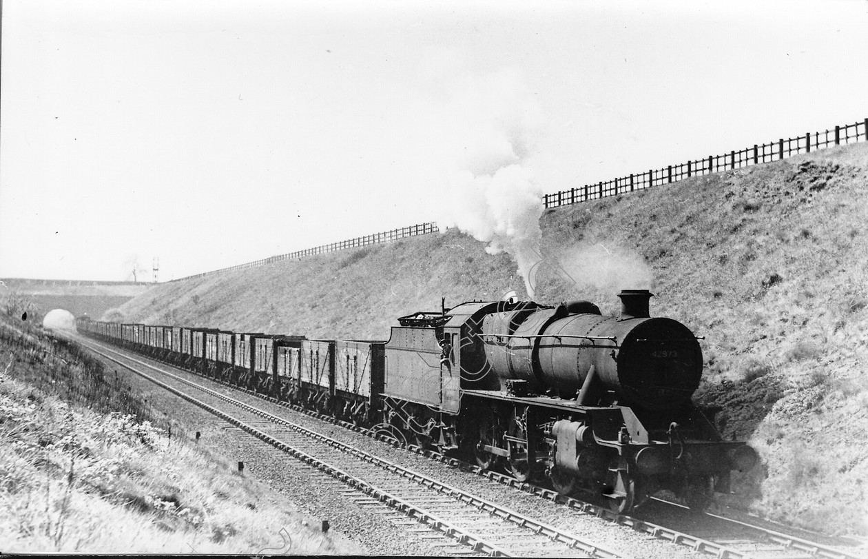 WD0681 
 ENGINE CLASS: Moguls 2-6-0 ENGINE NUMBER: 42973 LOCATION: Kenyon Junction DATE: 03 May 1949 COMMENTS: 
 Keywords: 03 May 1949, 42973, Cooperline, Kenyon Junction, Moguls 2-6-0, Steam, WD Cooper, locomotives, railway photography, trains